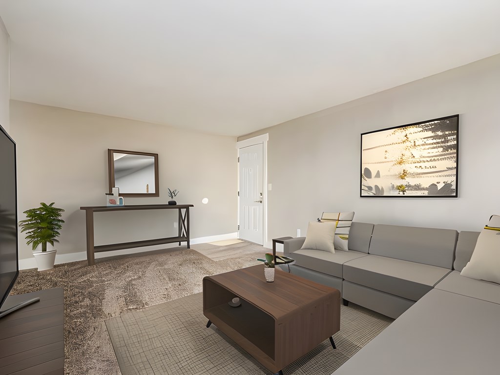 a living room with a gray couch and a coffee table