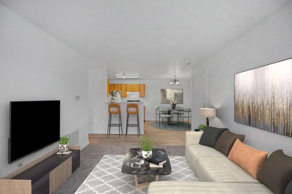 A living room with a white couch and a television on the left side at Crystal Glen Apartments, Ohio