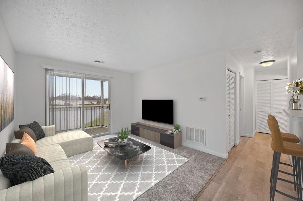 A living room with a grey sofa, a black coffee table, and a television at Crystal Glen Apartments, Findlay, 45840