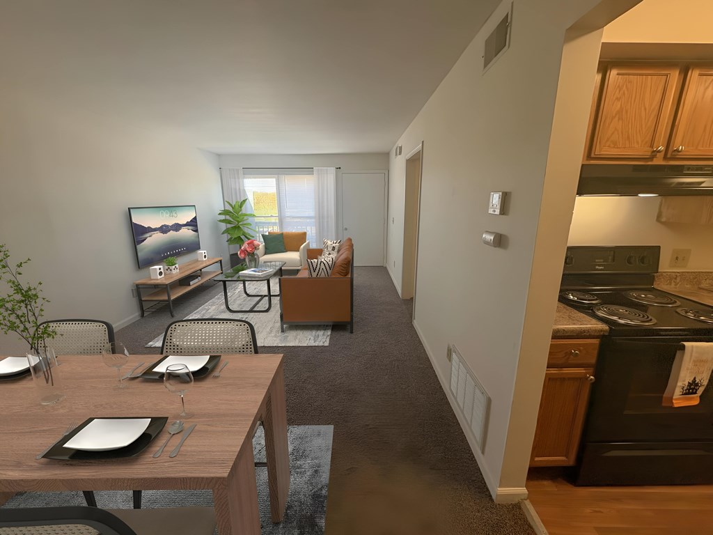 A modern kitchen with a dining table set for two.