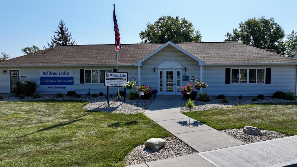 A building with a sign that says Willow Lake in front of it.