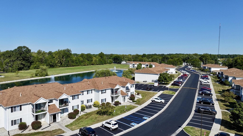A residential area with houses and a parking lot.