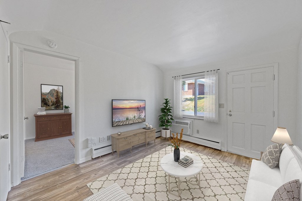 a living room with white walls and a white couch