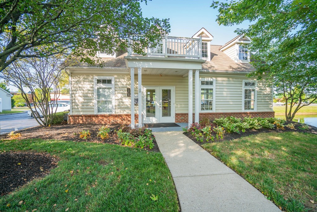 a white house with a sidewalk in front of it at Slate Ridge, Reynoldsburg, OH 43068