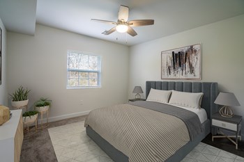 Bedroom with ceiling fan and light at Stonecrest Apartments, Columbus - Photo Gallery 28
