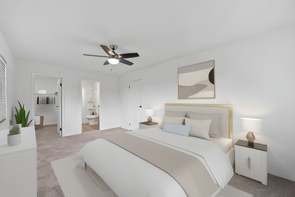 a white bedroom with a large bed and a ceiling fan