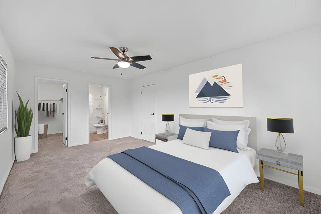 a bedroom with a large bed and a ceiling fan