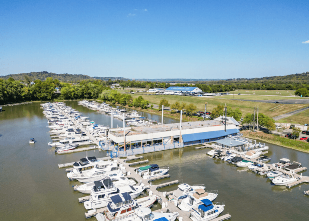 a marina with many boats parked at a dock