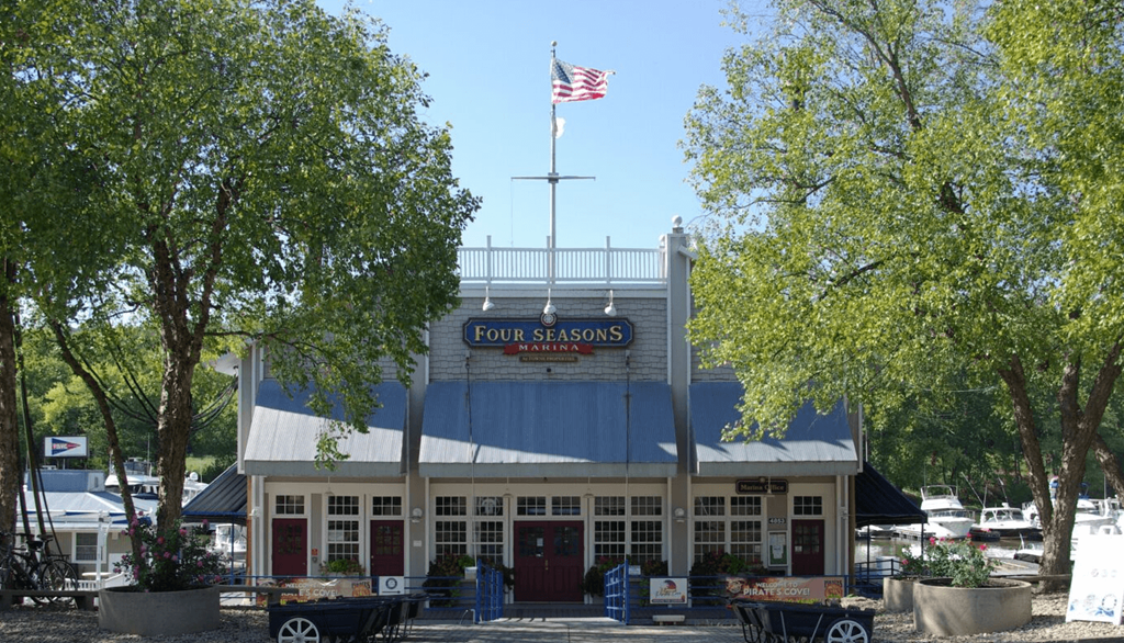 the front of a building with an flag flying