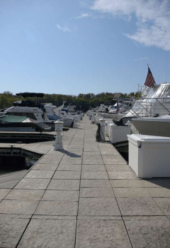 the dock at the marina is full of boats