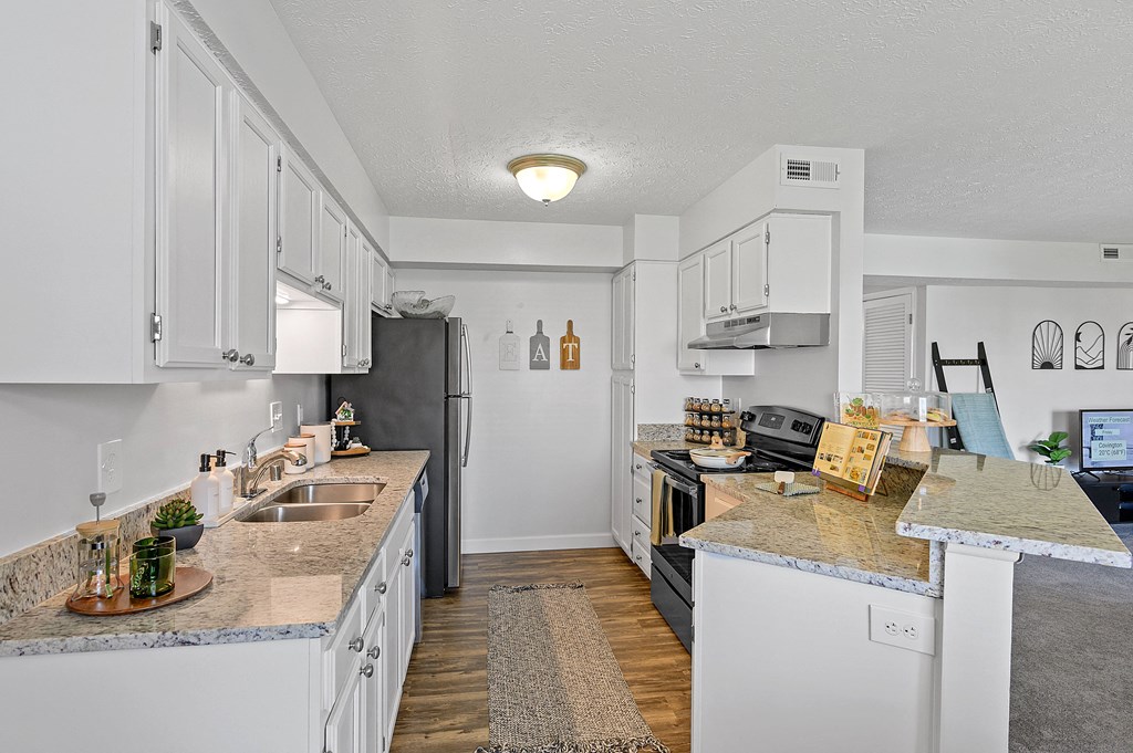 Kitchen with white cabinets and granite counter tops at Wrights Point, Ft Wright, KY, 41011
