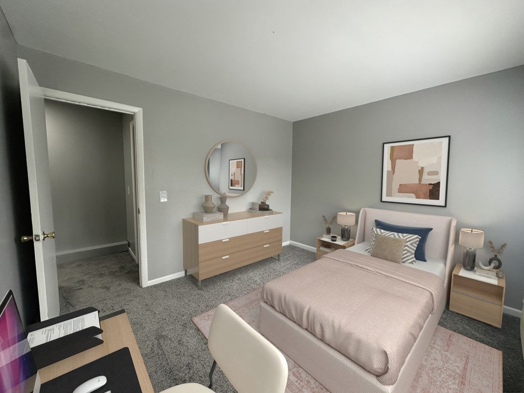 a bedroom with a bed and a dresser and a mirror