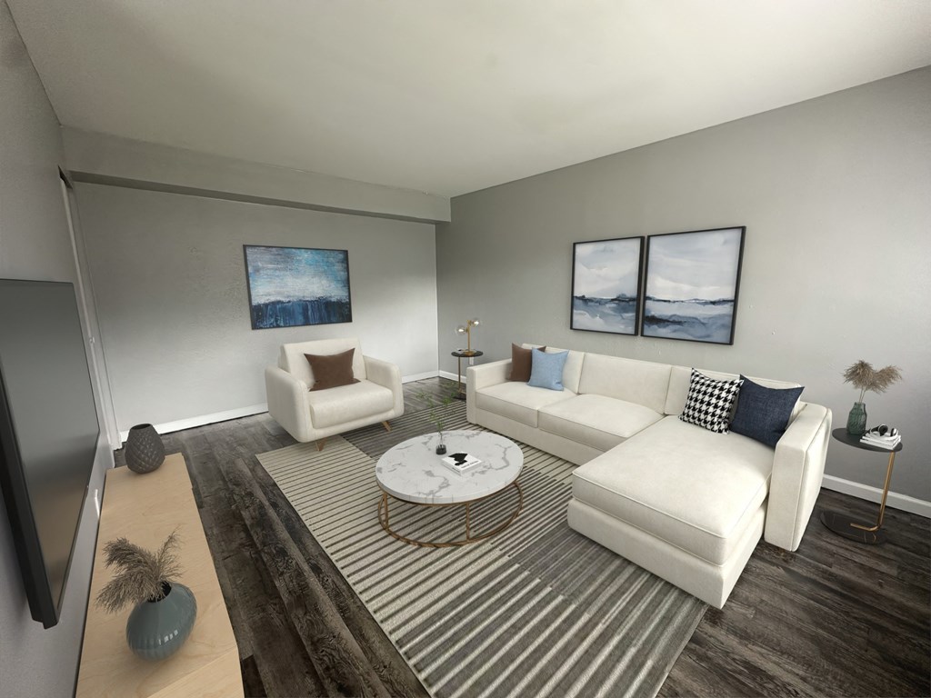 a living room with white furniture and a striped rug