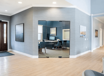 Living room with a large mirror and a dining room at Waterstone Landing, Perrysburg
