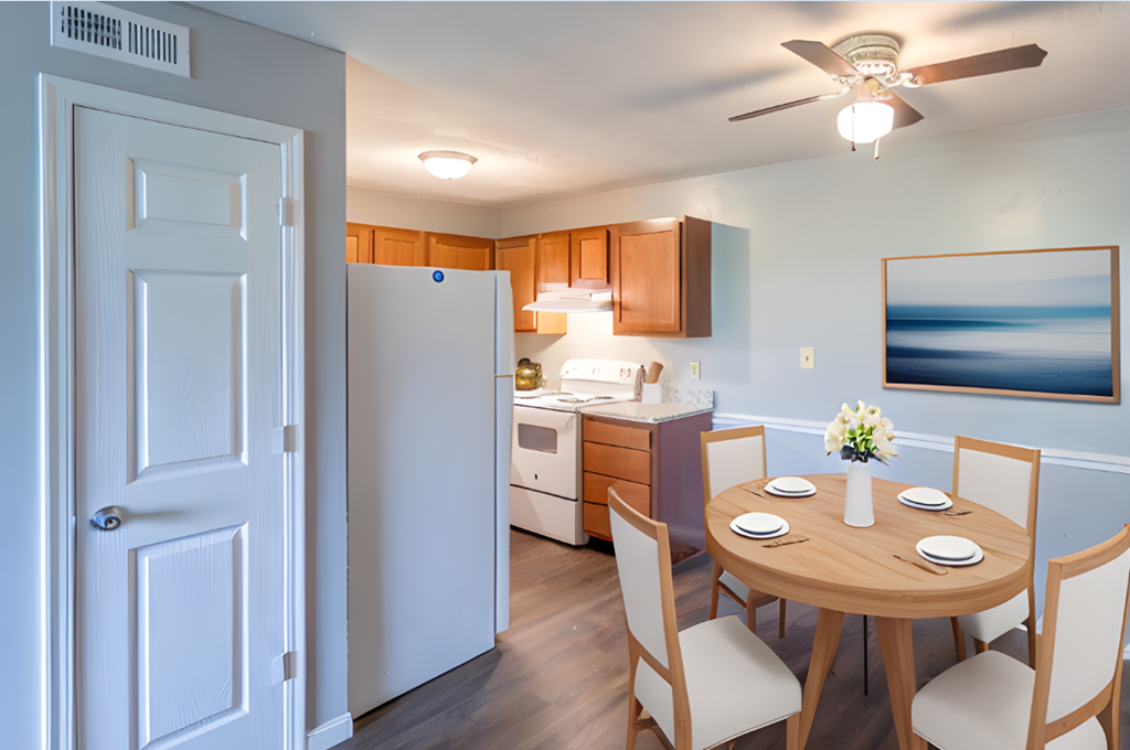 Kitchen and dining room with a table and chairs and a refrigerator at Crossings of Kenton, Erlanger, KY