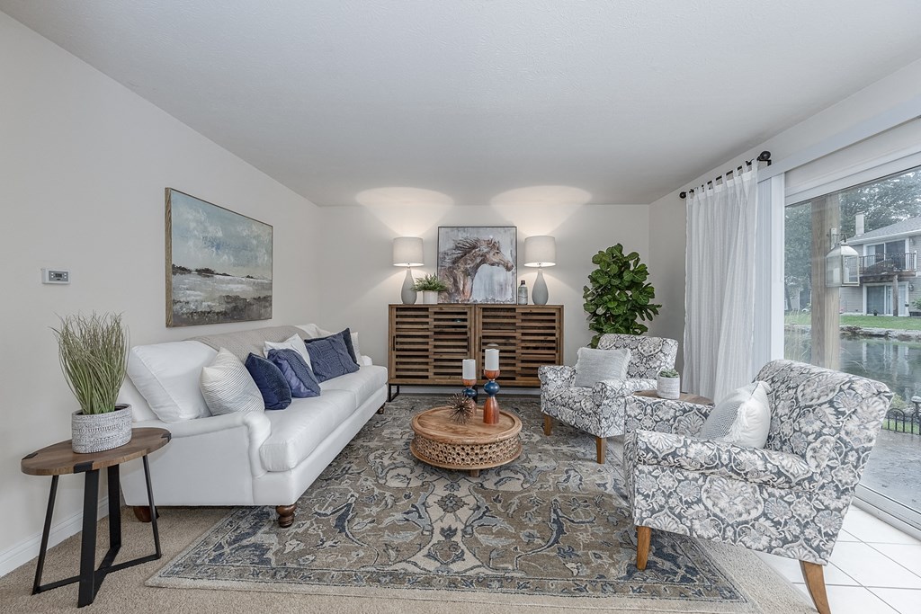 Living room with open kitchen at Harpers Point Apartments, Ohio