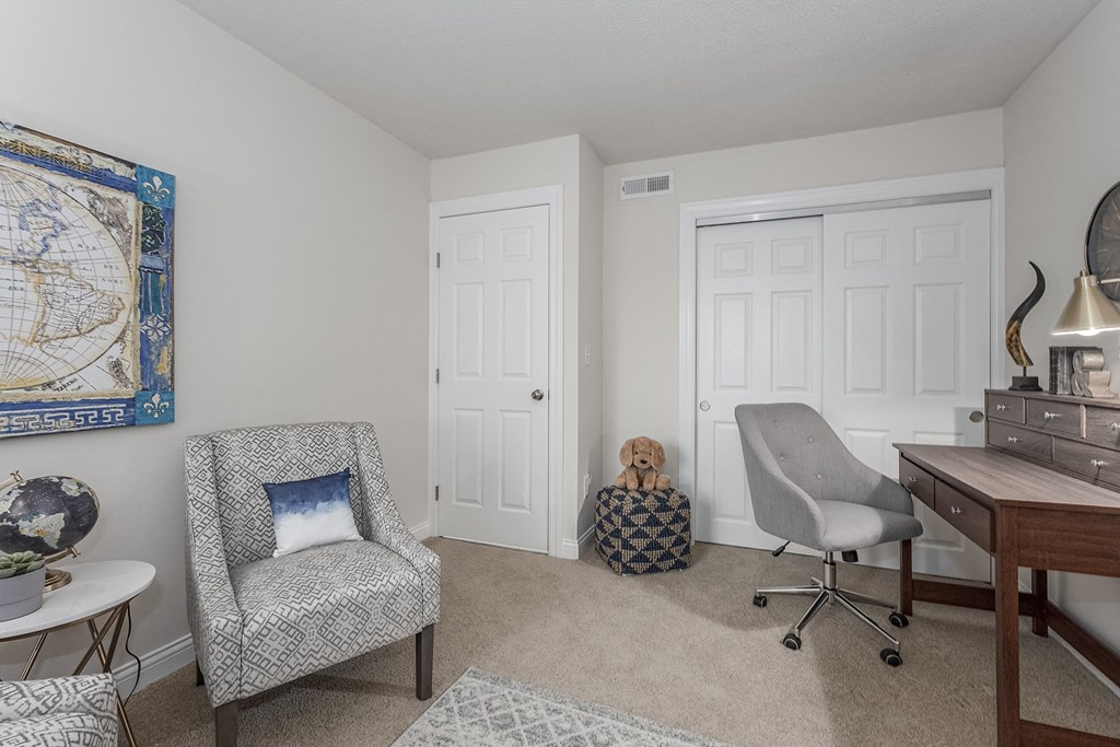 Living room sitting chairs at Harpers Point Apartments, Cincinnati