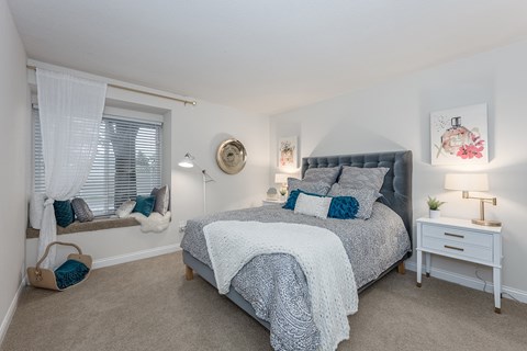 Bedroom with cozy bed at Harpers Point Apartments, Cincinnati, Ohio