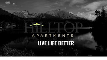 a black and white photo of a lake and mountains with the title hilltop apartments live life