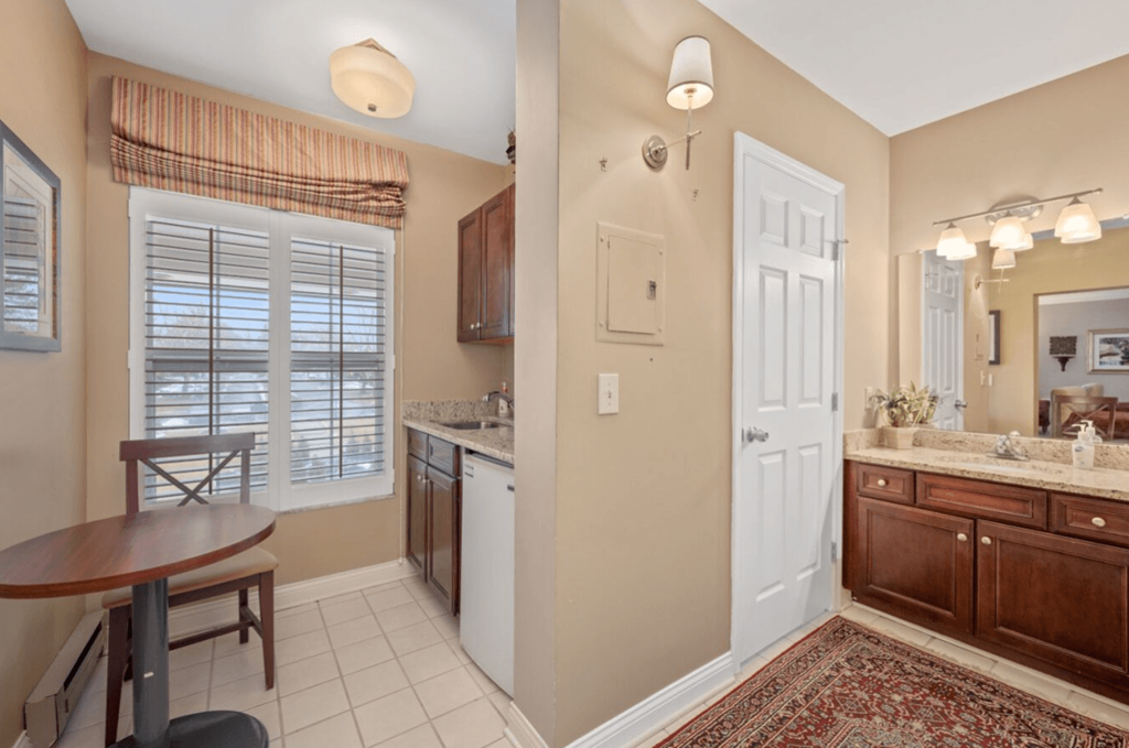 Kitchen and a dining room with a sink and a table at Indian Creek Apartments, Cincinnati
