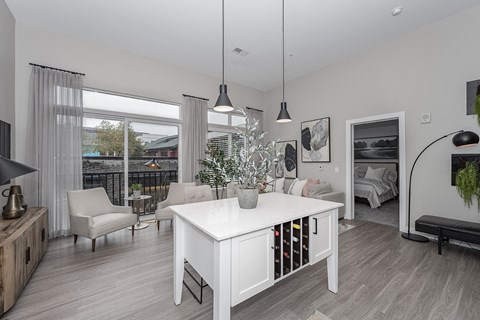 an open living room and dining room with a white table and chairs