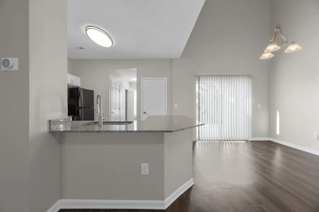 a kitchen and living room with a counter top at Traditions at Slate Ridge, Reynoldsburg Ohio