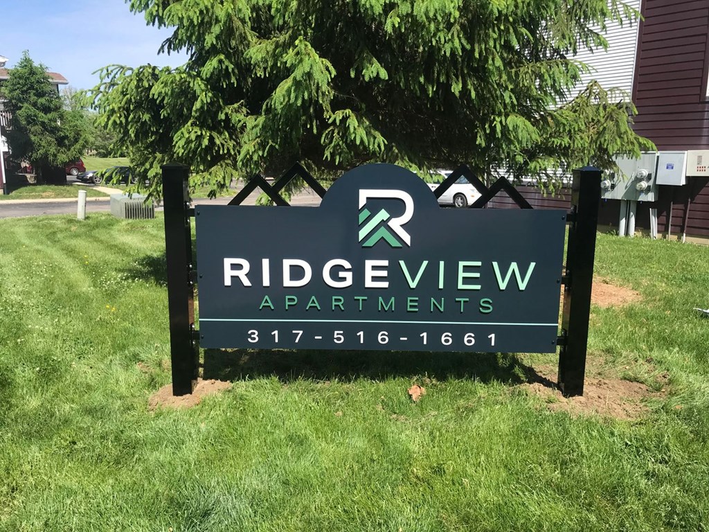 a sign in front of a tree at Ridgeview, Fortville, 46040