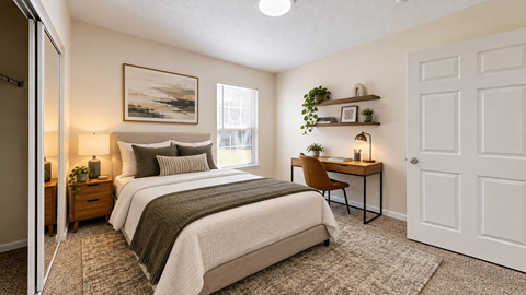 A bedroom with two beds, a desk, and a chair.