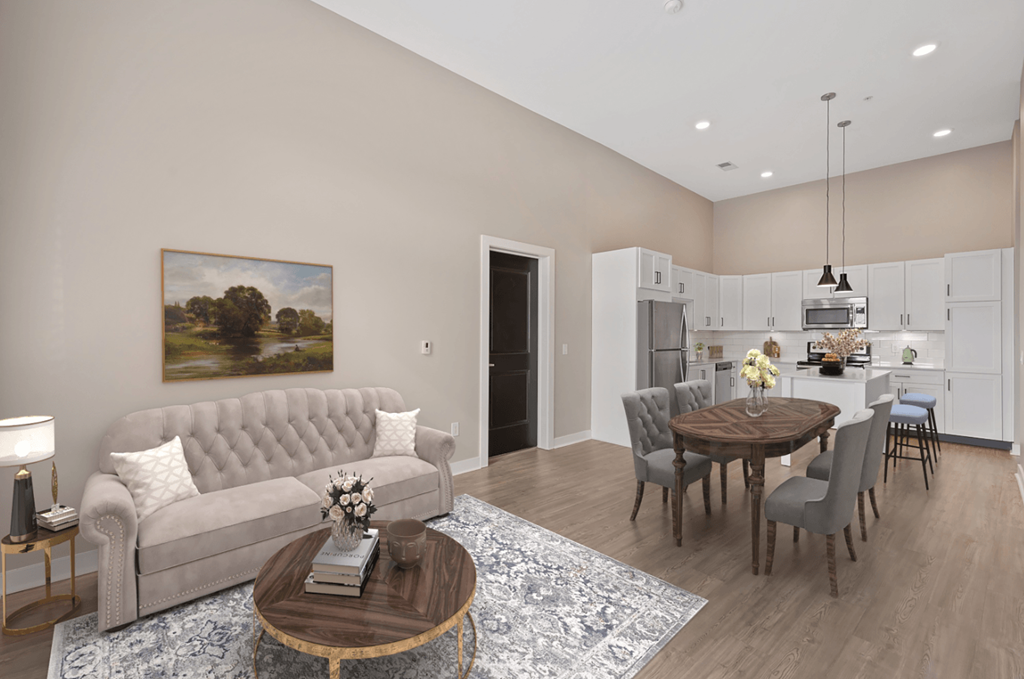 a living room and dining room with a couch and a table