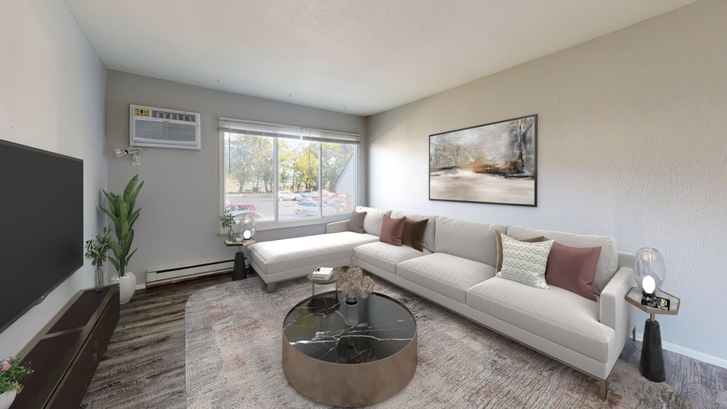 A living room with a white couch and a coffee table.
