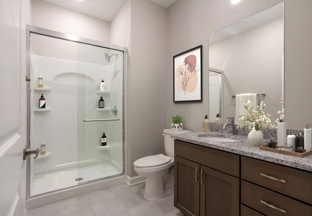 a bathroom with a shower and a toilet and a sink at Adelphi Quarter, Columbus, OH, 43203