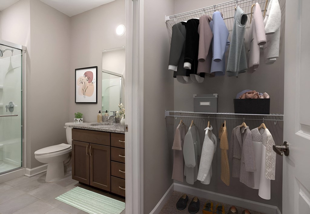 a bathroom with a shower and a sink and a rack of towels on the wall at Adelphi Quarter, Ohio, 43203