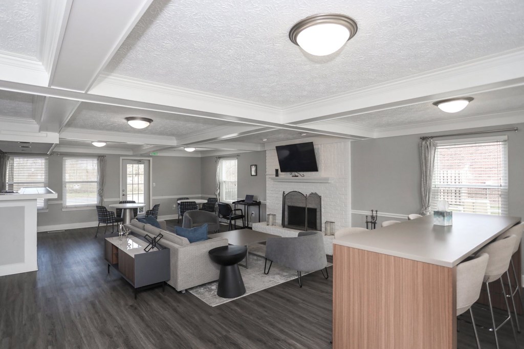 A modern living room with a fireplace and a television.