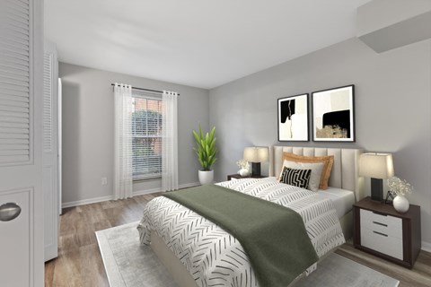 Empty bedroom with a bed and two windows at Merrick Place, Lexington, KY