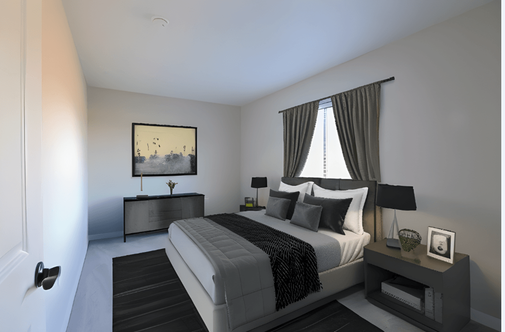 a black and white bedroom with a bed and a window