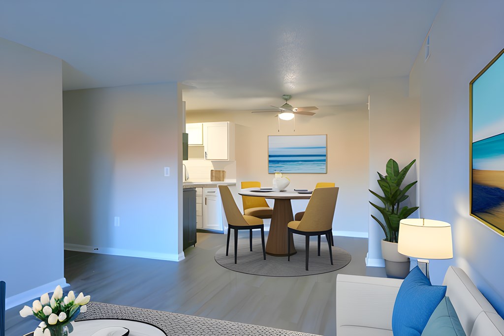 a living room and dining room with a table and chairs