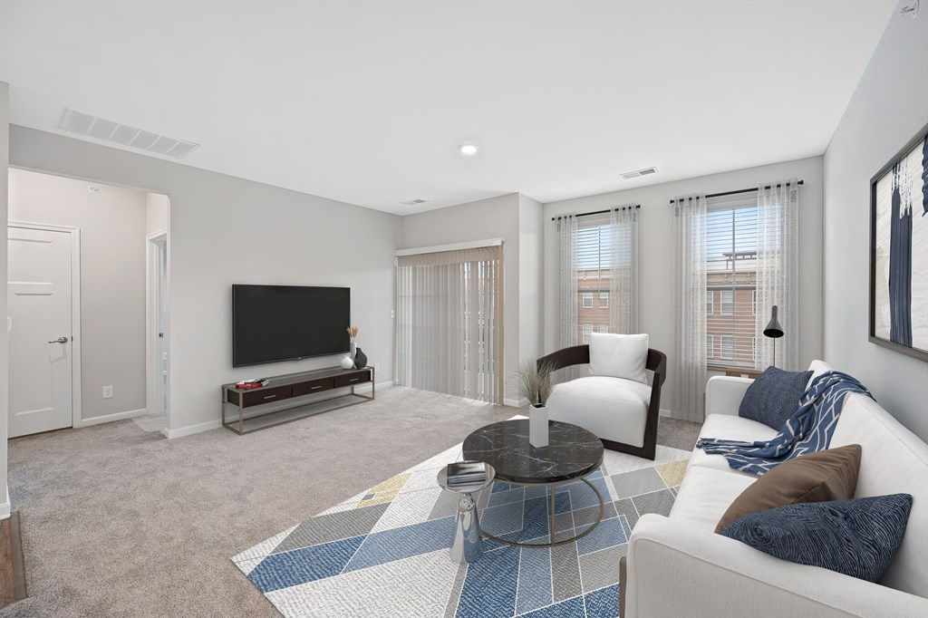 a living room with a couch and a chair and a television at Monmouth Row Apartments, Newport, 41071