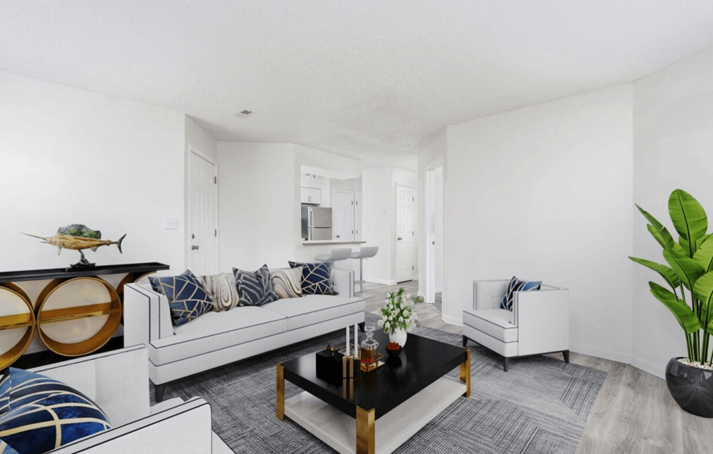 a living room with a couch and a coffee table at The Berryessa Apartments, Columbus
