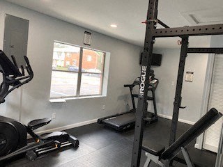 a gym with exercise equipment and a window