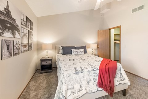 a bedroom with a bed and a closet at Parkside at Maple Canyon Apartments, Ohio, 43229