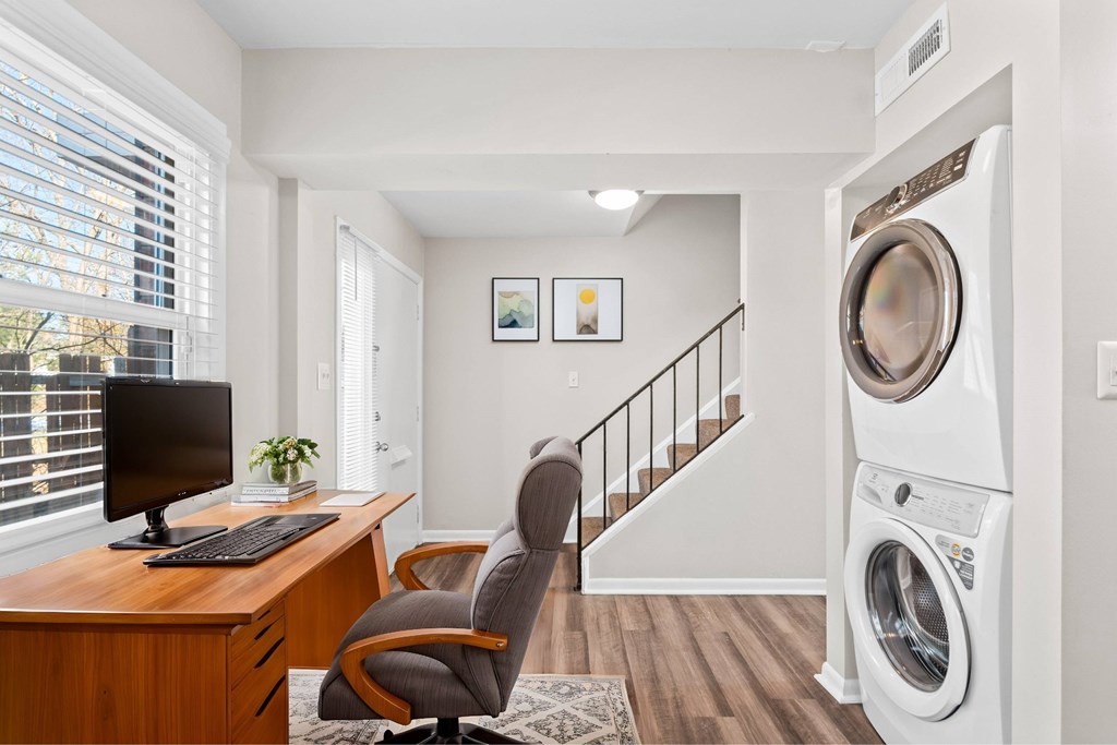 A washing machine is in a laundry room at Fountain Parc Apartments, Indianapolis, 46220