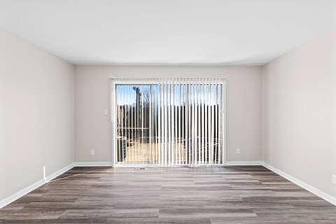 A room with a large window and a wooden floor at Fountain Parc Apartments, Indianapolis, 46220