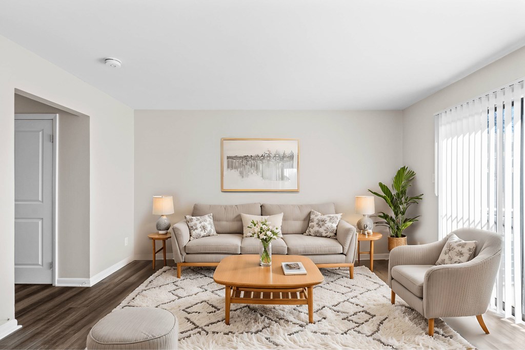 A living room with a grey couch, a coffee table at Fountain Parc Apartments, Indiana 46220