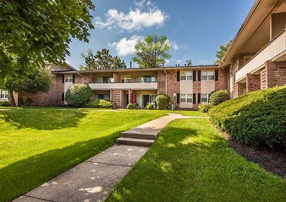A residential building with a green lawn in front at Fountain Parc Apartments, Indianapolis, 46220