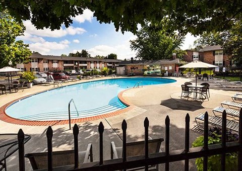 A pool surrounded by a black fence at Fountain Parc Apartments, Indianapolis, IN