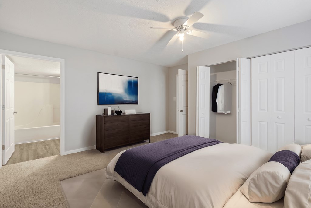 a bedroom with a bed and a closet