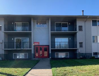 The image shows apartment number 2801 with a red door and a balcony.