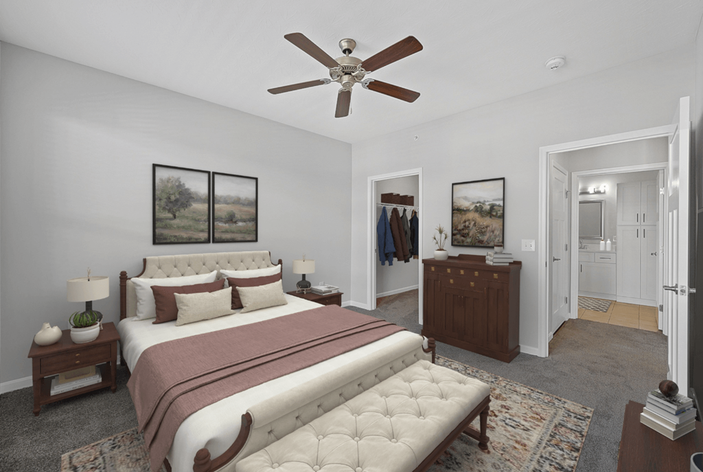 a bedroom with a bed and a ceiling fan at Monmouth Row Apartments, Newport, 41071