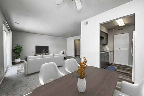 a living room with white furniture and a wooden table