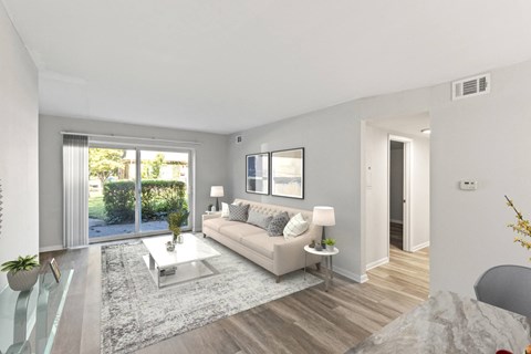 a living room with a couch and a table at Merrick Place, Lexington, KY